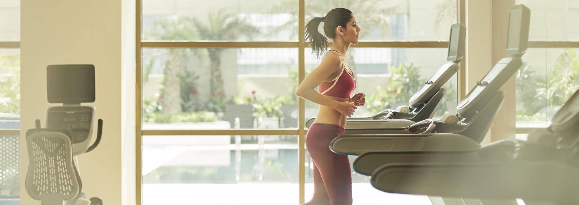 Taj Swarna, Amritsar Hotel Exterior foto A woman exercising on a treadmill